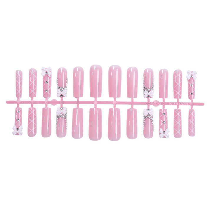Artificial nail set with romantic bow and glitter accents Kalsten
