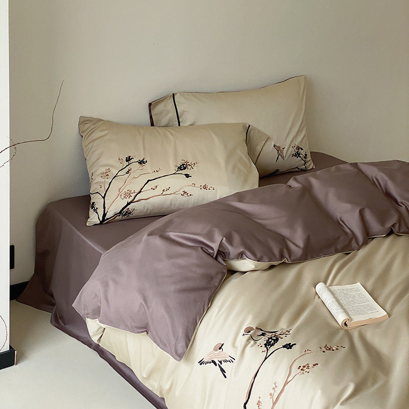 Reversible cotton satin bed set with finely embroidered bird and branch motifs