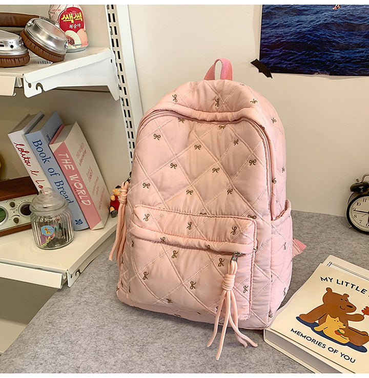 Quilted Backpack with Decorative Tassels