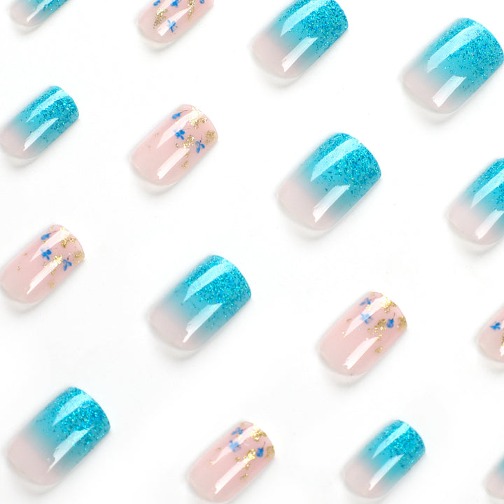 Artful acrylic nails with floral design and glitter effects Kalsten