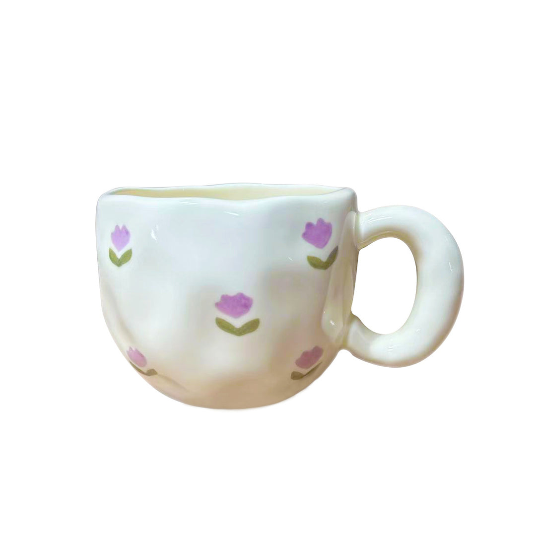 Ceramic mug with hand-painted tulip pattern and organic shape