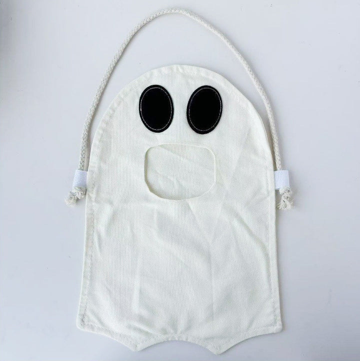 Children's candy tote bag with carrying slot, drawstring and pumpkin appliqué