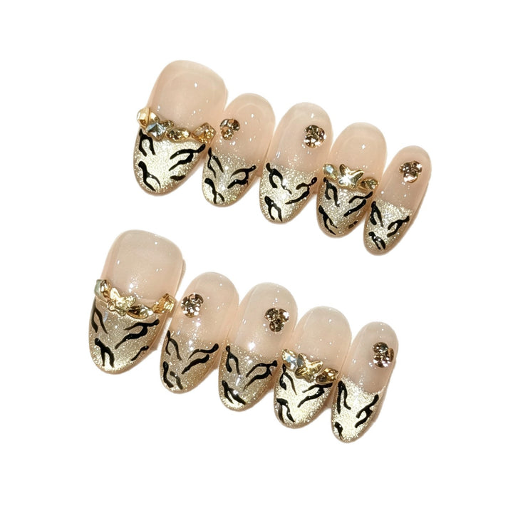 Artistic Press-On Nail Art Set with Luxurious Gold and Black Motifs