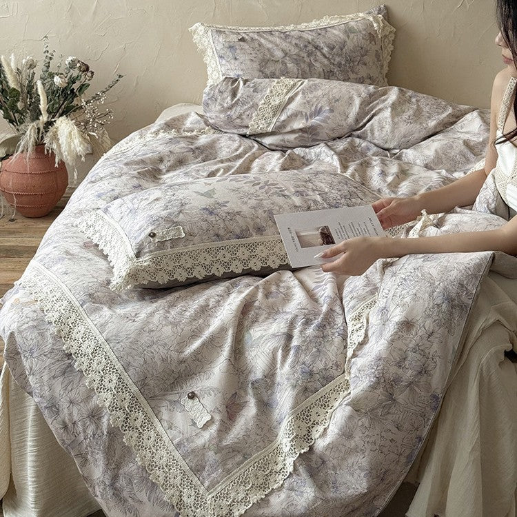 Duvet cover set made of cotton percale with fine lace trim and botanical watercolor pattern