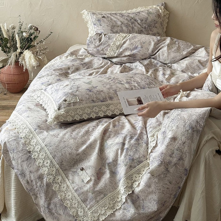 Duvet cover set made of cotton percale with fine lace trim and botanical watercolor pattern