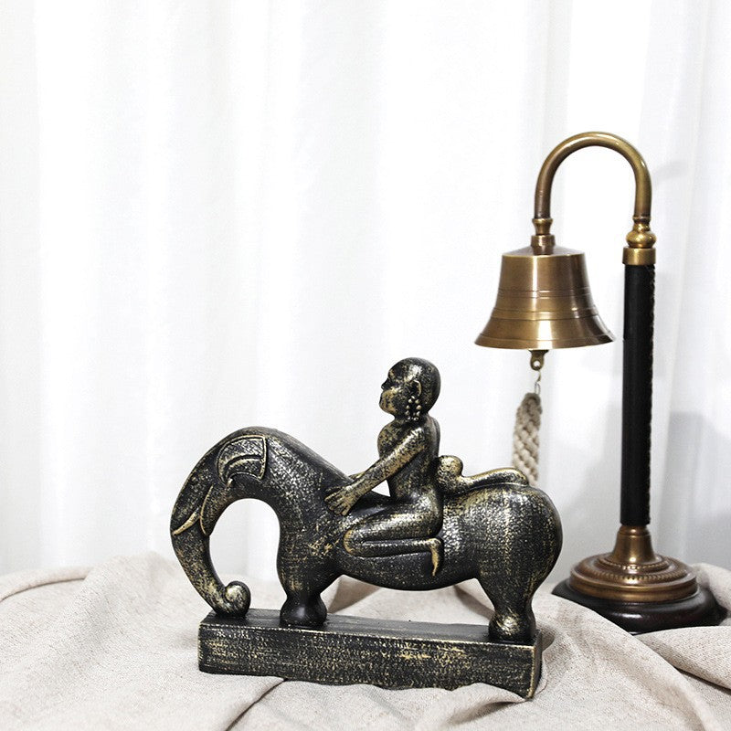 Whimsical Elephant and Child Sculpture