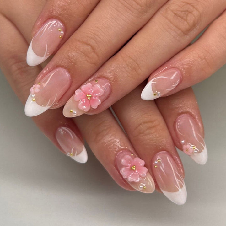 Artful stiletto nails with elegant floral design and glitter details Kalsten