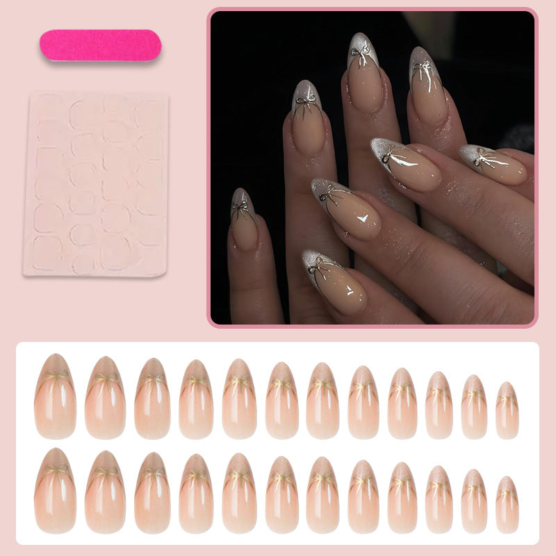 Nail art set with elegant black and white lace design and delicate bow embellishments Kalsten