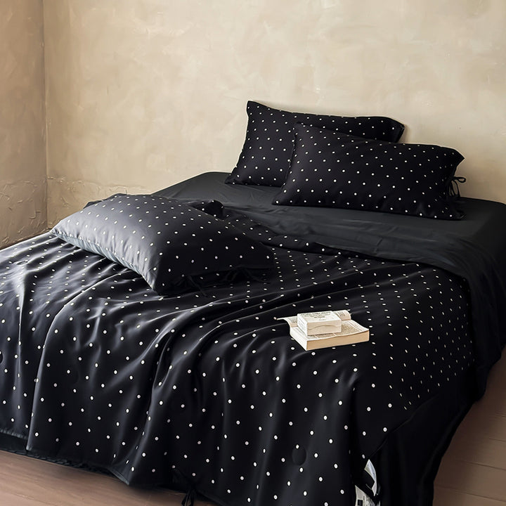 Satin bedding set with delicate polka dot pattern and satin finish