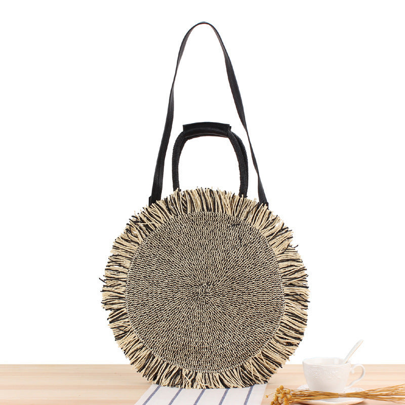 Round Bast shoulder bag with fringes and leather handles Kalsten