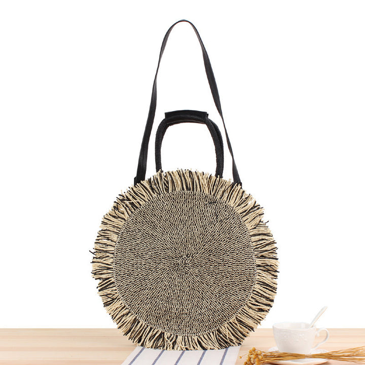 Round Bast shoulder bag with fringes and leather handles Kalsten