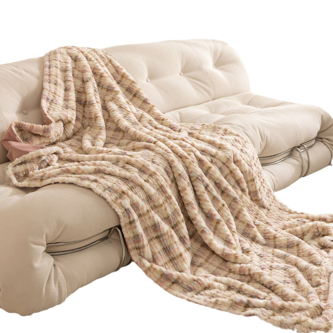 Cozy blanket made of luxurious synthetic fur with wavy texture and soft microfiber back Kalsten