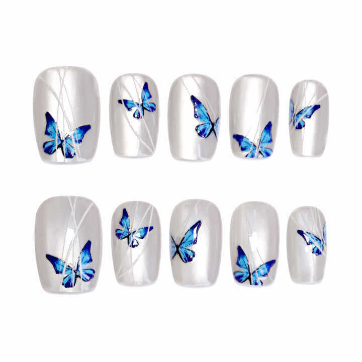 Creative nail extensions with intricate butterfly design Kalsten