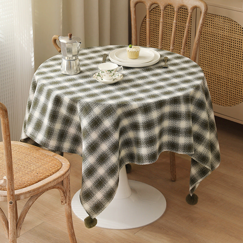 Square tablecloth made of cotton blend fabric with checkered weave pattern and pom-pom corners Kalsten