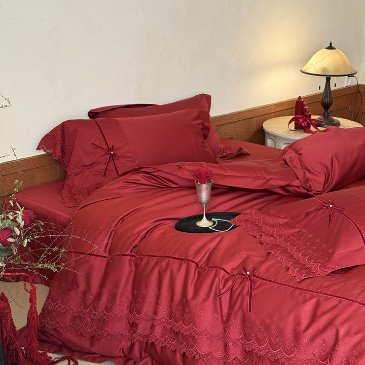 Luxurious bed linen set with lace edging, ruffles, and decorative bows Kalsten
