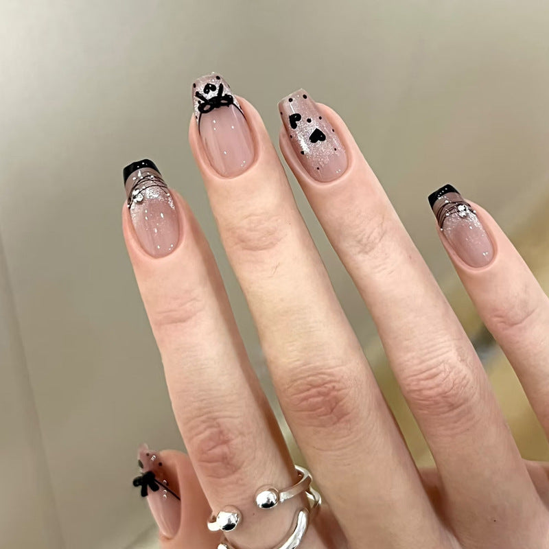 Elegant Artful Nail Design with Bow and Sparkle Accents Kalsten