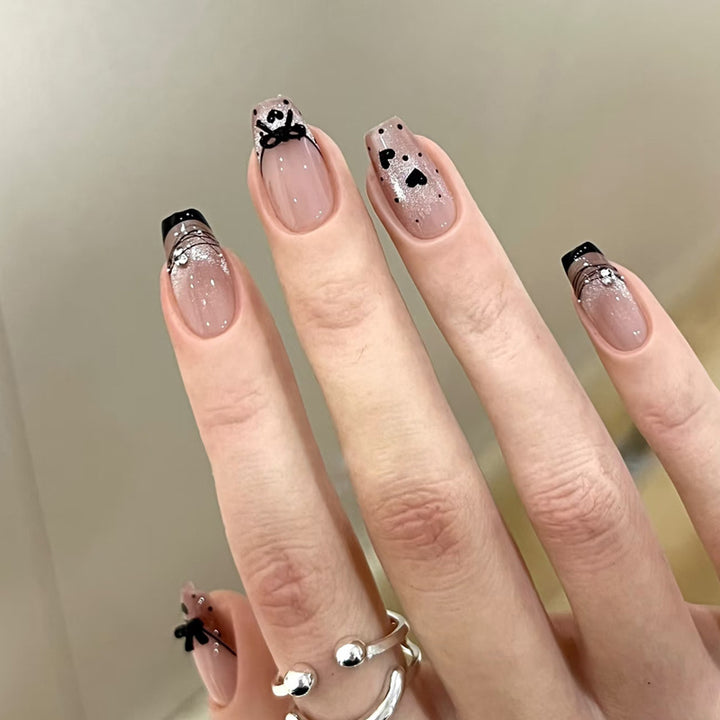 Elegant Artful Nail Design with Bow and Sparkle Accents Kalsten