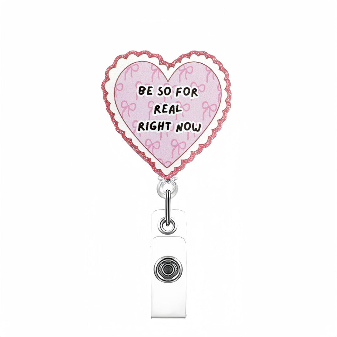 Expandable badge holder with anatomical heart pendant