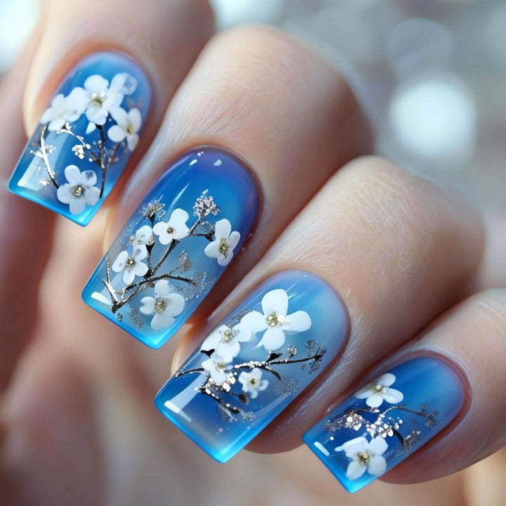 Artificial nail set with floral designs and glitter accents Kalsten