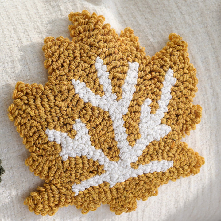 Rectangular decorative cushion cover made of linen look with raised leaf appliqués and corner tassels Kalsten