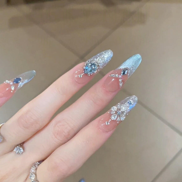 Glamorous artificial nails with sparkling rhinestone accents Kalsten