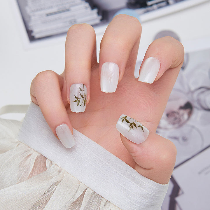 Artistic nail extensions with floral accents Kalsten