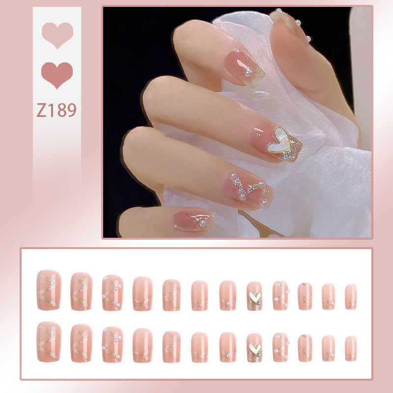 Nail art set with elegant wave patterns and delicate pearl accents Kalsten