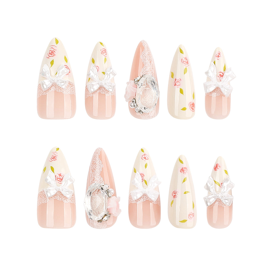 Artful stiletto nails with floral accents and glitter accents Kalsten