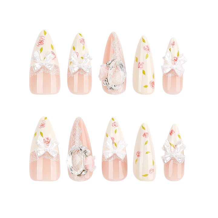Artful stiletto nails with floral accents and glitter accents Kalsten