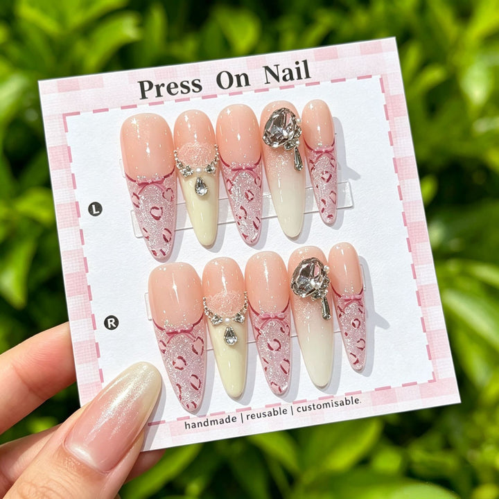 Artistic Press-On Nail Art Set with Cute Character and Bow Accents