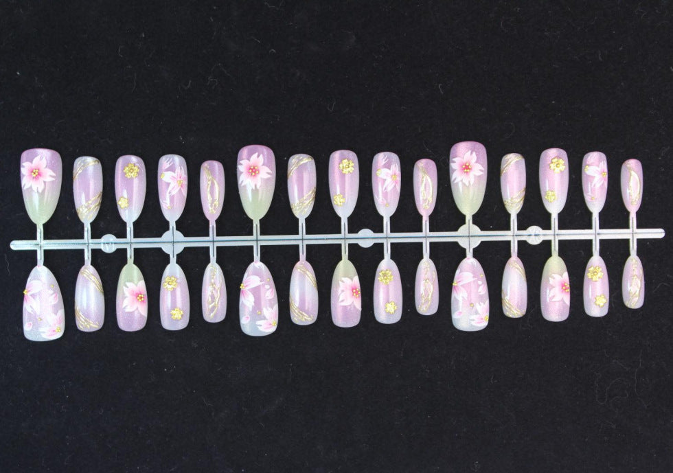 Artificial nails with floral design and gold accents Kalsten