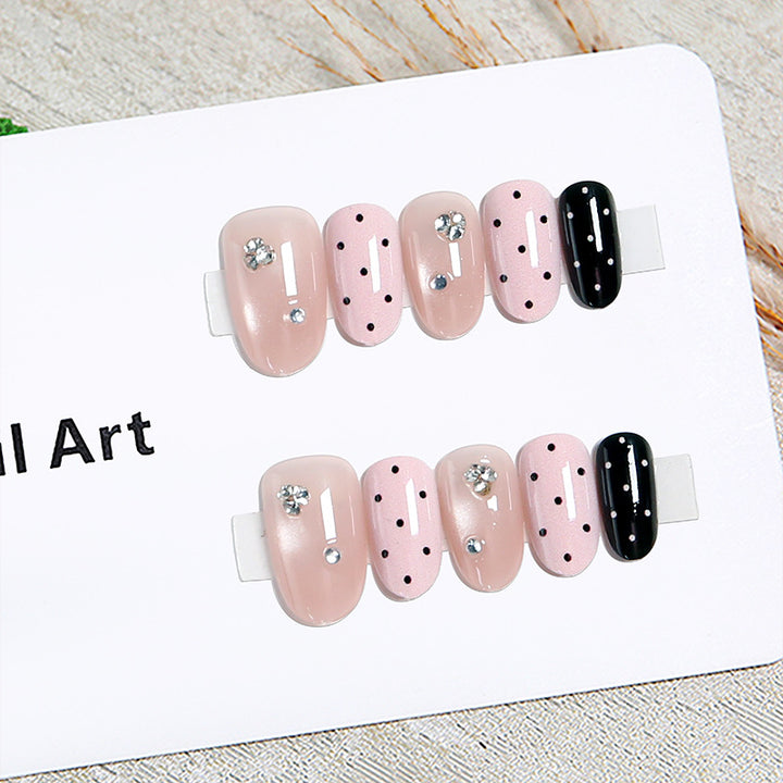 Acrylic nail set with glamorous rhinestone accents and modern dots Kalsten