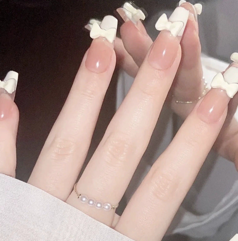 Elegant nail design with pearl embellishment Kalsten