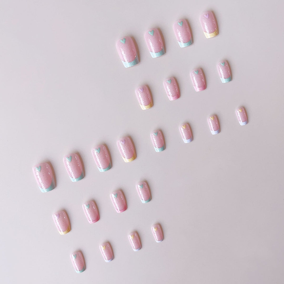 Artificial nail set with playful color gradients and heart motifs Kalsten