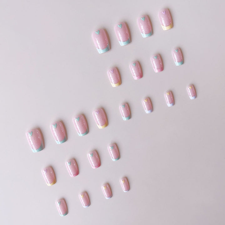 Artificial nail set with playful color gradients and heart motifs Kalsten