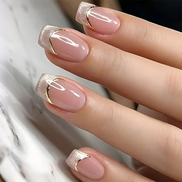 Artificial nail creations with elegant gold trim Kalsten