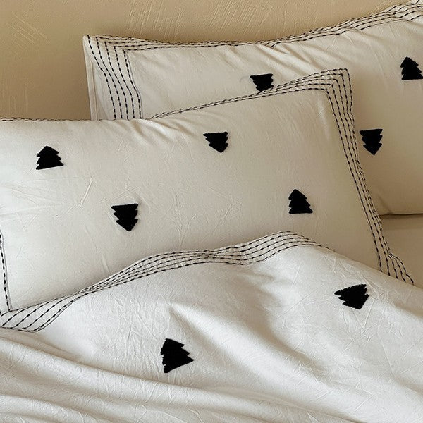 Linen-cotton blend duvet cover set with embroidered accent motifs and striped border