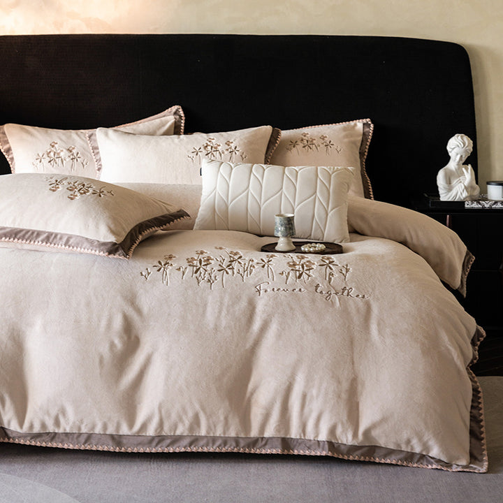 Premium cotton satin bed linen set with floral relief embroidery and satin trim