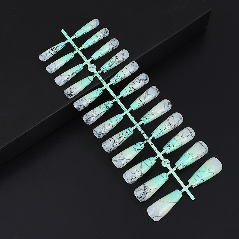 Artificial nails in modern ombre design with marbled accents Kalsten