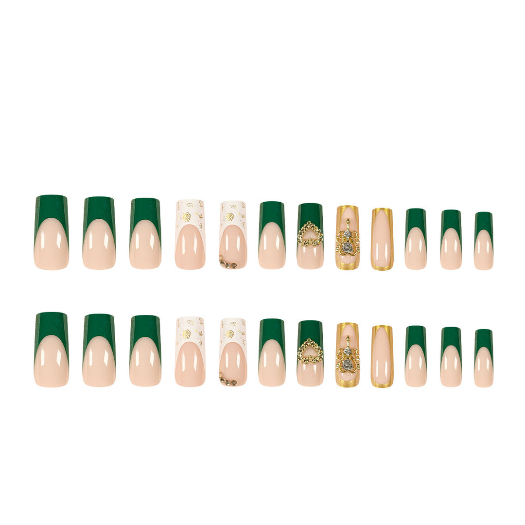 Exquisite artificial nails with gold embellishments and glitter accents Kalsten