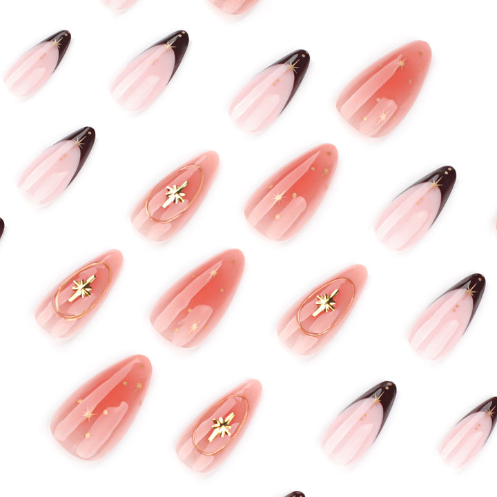 Artful stiletto nails with elegant gold embellishments Kalsten