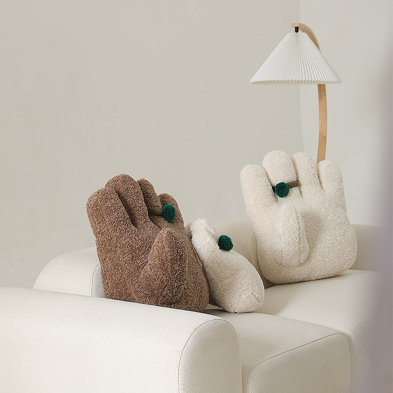 Plush decorative pillow in hand shape with pompon application Kalsten