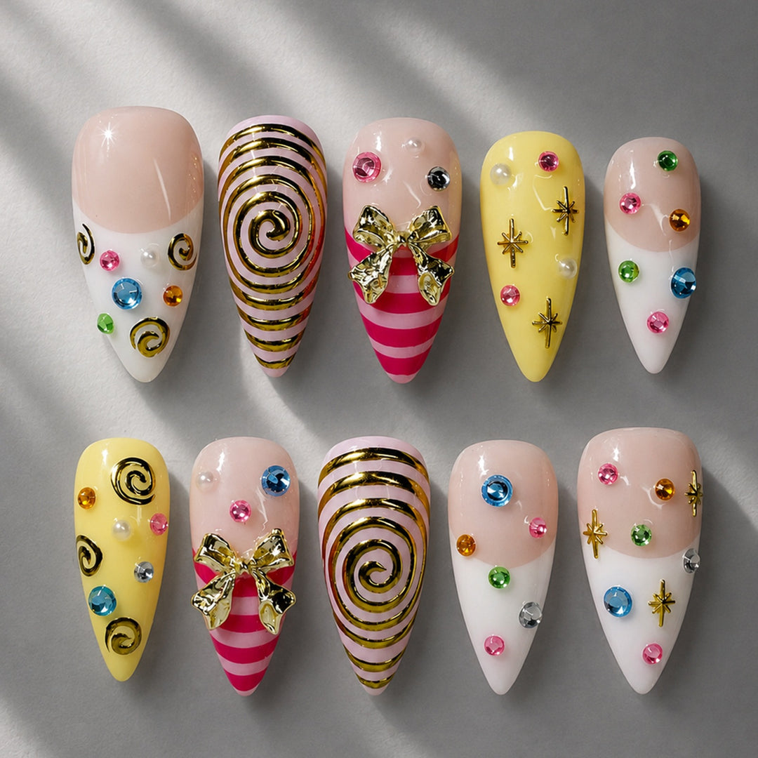 Glamorous artificial nail set with playful designs and sparkling accents Kalsten