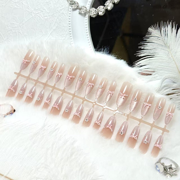 Artificial nails with elegant glitter and bow design Kalsten