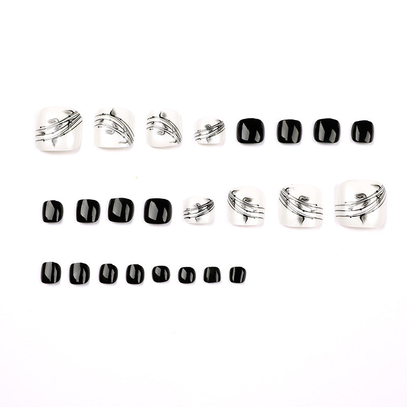 Artful toenail art in elegant black and white design Kalsten