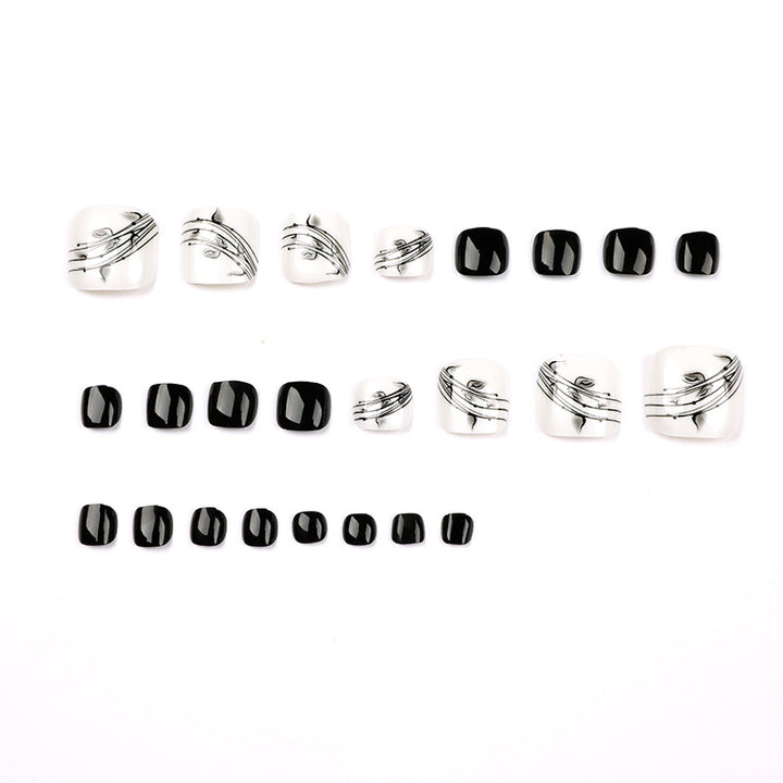 Artful toenail art in elegant black and white design Kalsten