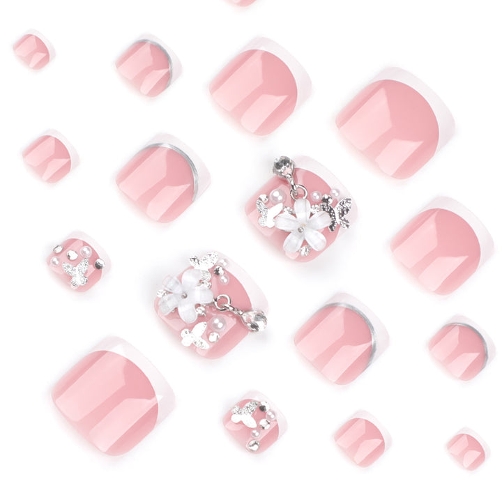 Artful toenail design with elegant flower and glitter accents Kalsten
