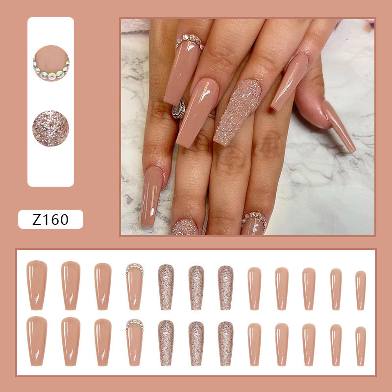 Glamorous artificial nail extensions with rhinestone and glitter details Kalsten