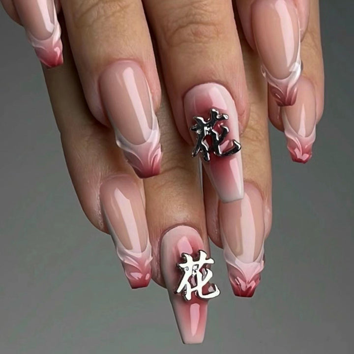 Artful stiletto nails with floral accents and 3D details Kalsten