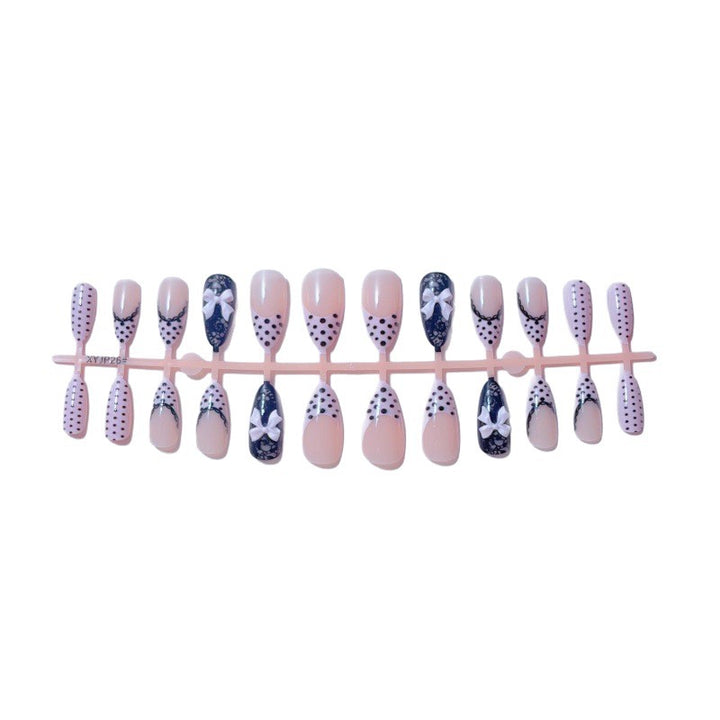 Elegant artificial nails with lace design and bow accents Kalsten